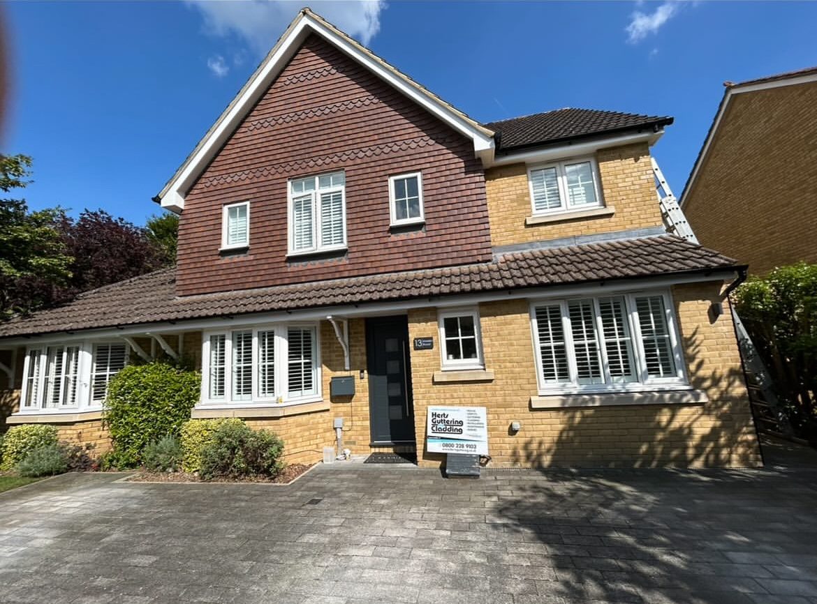 Detached house with new black guttering