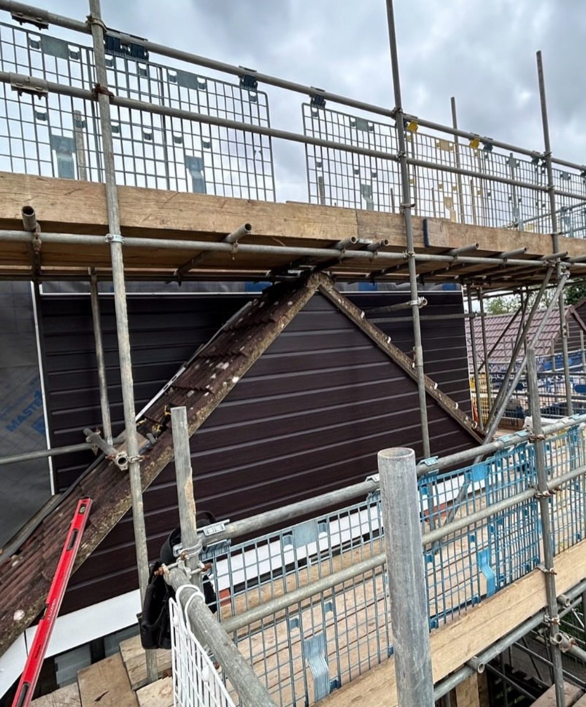 Herts Guttering and Cladding team working on a roofline replacement