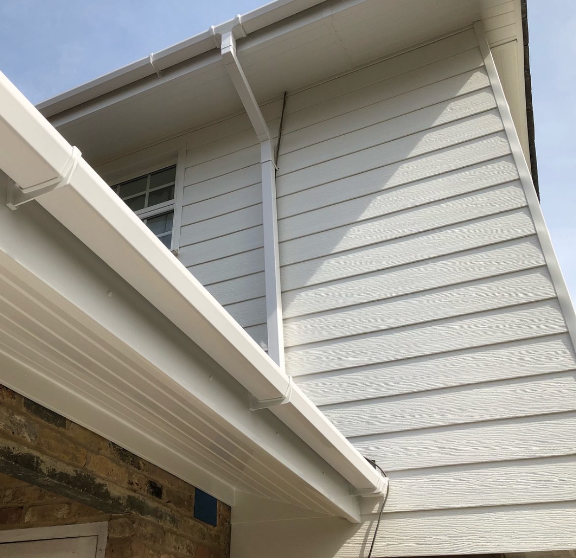 Close up of new white soffit and cladding detail