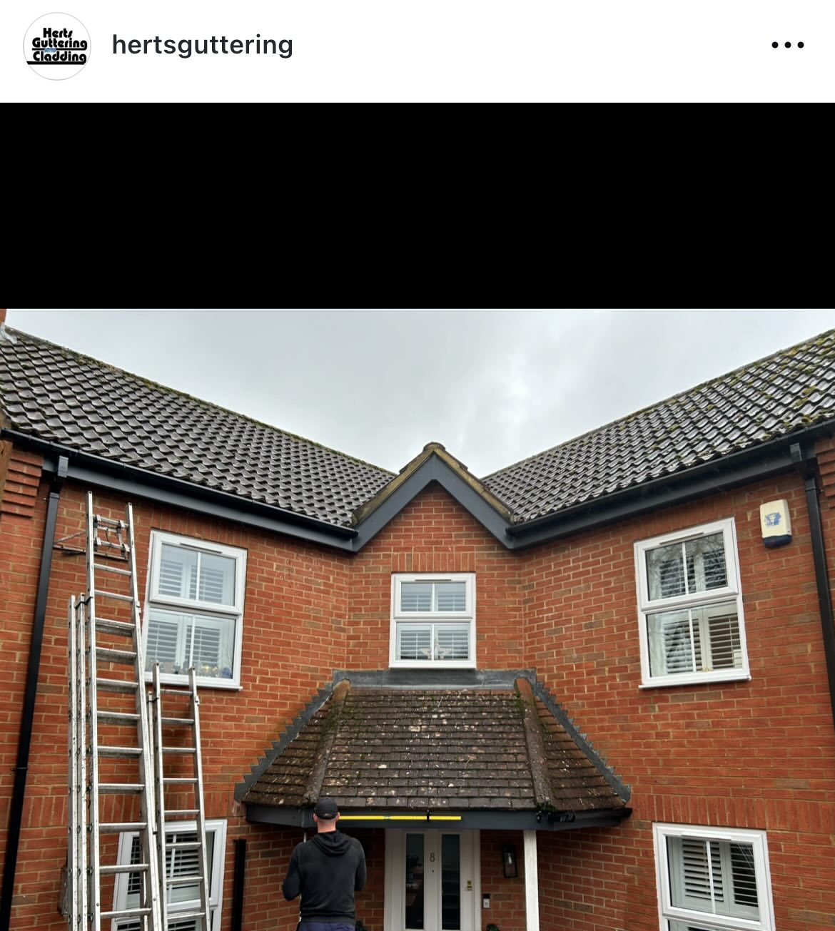 House with new black guttering and fascia